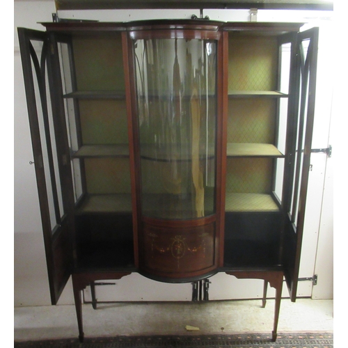 19 - An Edwardian satinwood inlaid mahogany display cabinet with a central bow front panel, flanked by tw... 