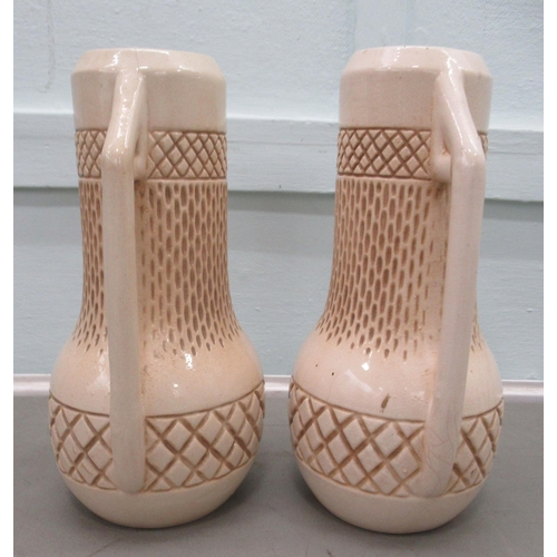 195 - A pair of Bretby china twin handled vases of bulbous cylindrical form  11