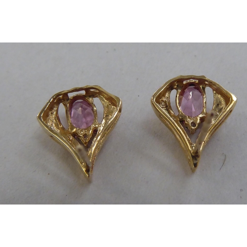 206 - A pair of 10k gold earrings, each set with a pink stone and a diamond