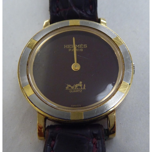 207 - A lady's gold plated, stainless steel cased Hermes of Paris wristwatch, the quartz movement faced by... 