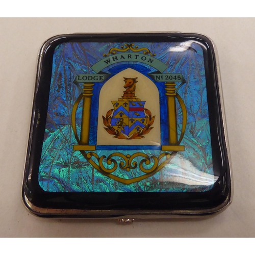 210 - A stainless steel, enamel and butterfly wing effect masonic powder compact with Wharton Lodge No.204... 