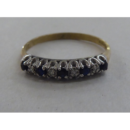 211 - A 9ct gold eternity ring, set with alternating sapphires and diamonds