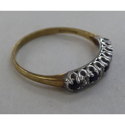 211 - A 9ct gold eternity ring, set with alternating sapphires and diamonds