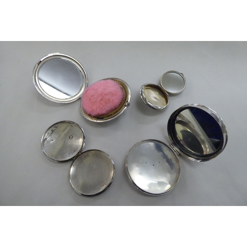 217 - Four silver and white metal powder compacts; and similar cases