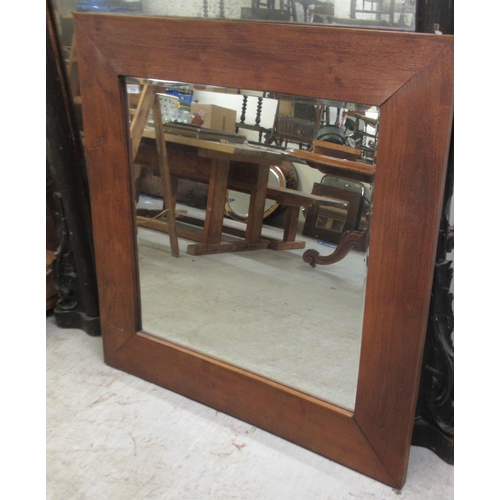 218 - A modern mirror, the bevelled plate set in a hardwood frame  39.5