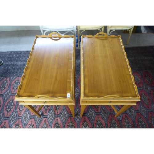 22 - A pair of modern oak butler's tray top design side tables, each with a gallery, raised on square, ta... 