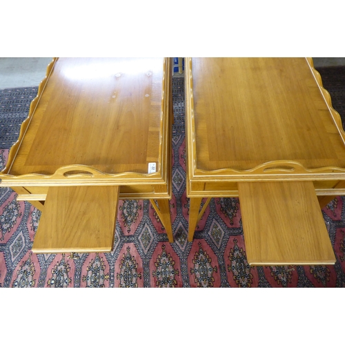 22 - A pair of modern oak butler's tray top design side tables, each with a gallery, raised on square, ta... 