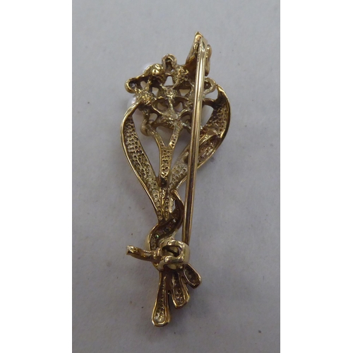 221 - A 9ct gold brooch, fashioned as a bouquet, set with pearls and diamonds