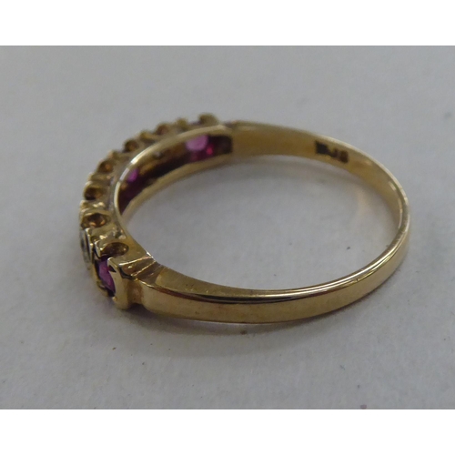 224 - A 9ct gold eternity ring, set with alternating rubies and diamonds