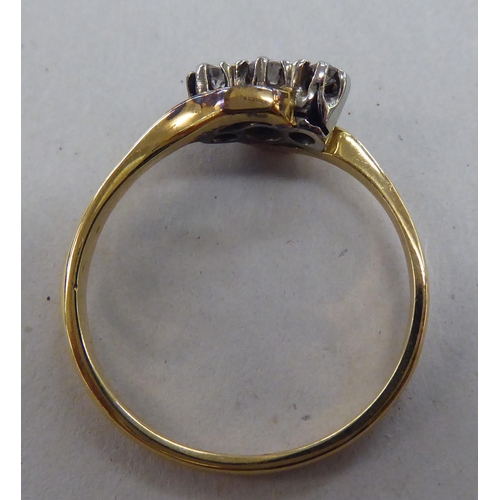 229 - An 18ct gold ring, set with three diamonds