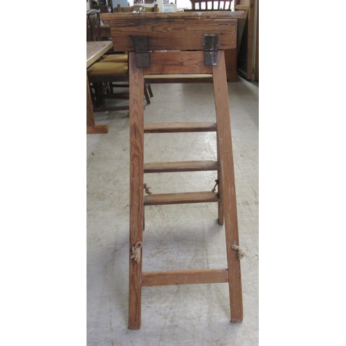 257 - An early 20thC pine, five tread, folding steps