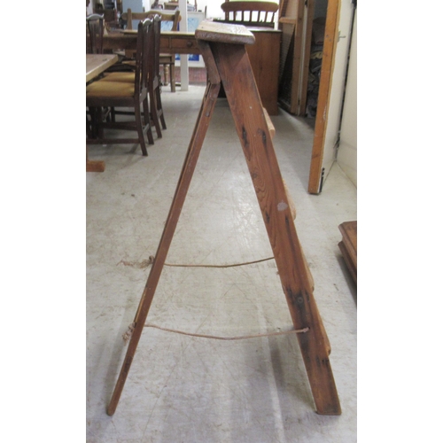 257 - An early 20thC pine, five tread, folding steps