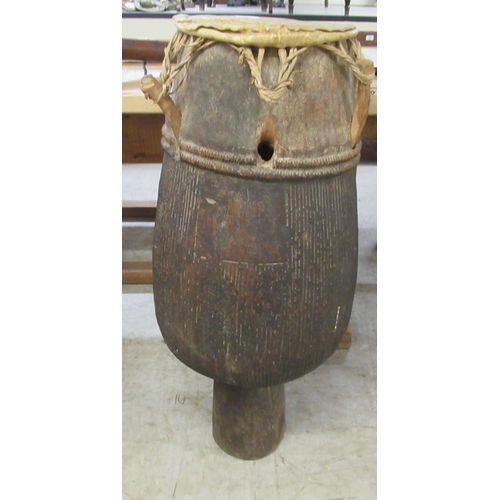 258 - An African carved hardwood, floorstanding tribal drum  32