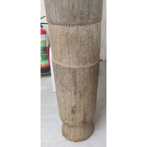 261 - An African carved hardwood, floorstanding tribal drum  54