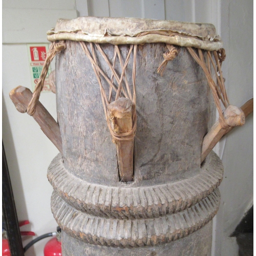 261 - An African carved hardwood, floorstanding tribal drum  54