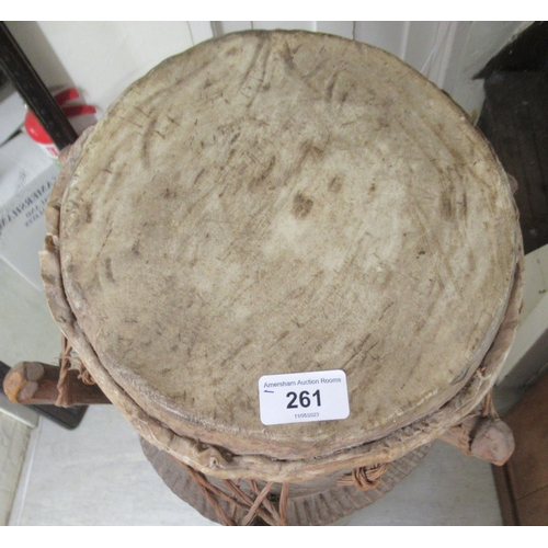 261 - An African carved hardwood, floorstanding tribal drum  54