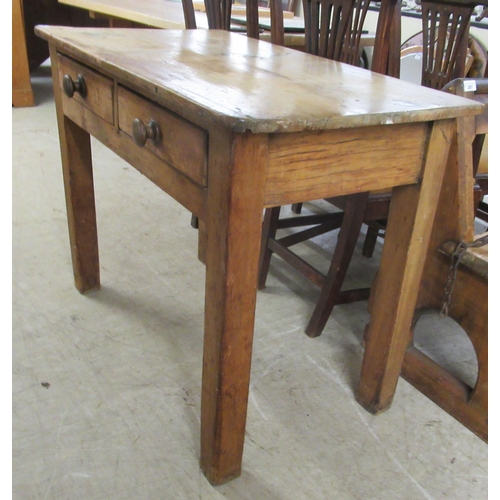 279 - A late 19thC rustic pine, two drawer kitchen table, raised on square, tapered legs  29