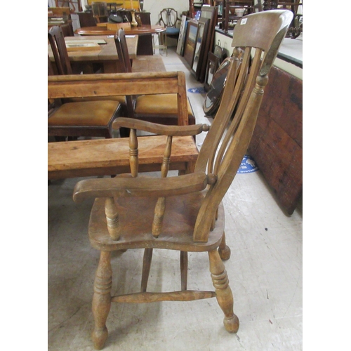 280 - A 19thC rustically constructed oak and pine, open arm, splat back veranda chair, the solid seat rais... 