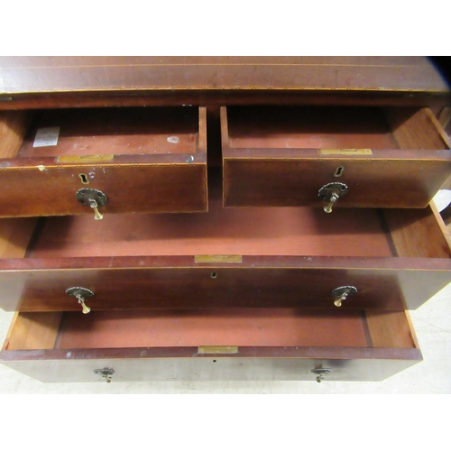 281 - An Edwardian lady's string inlaid mahogany  bureau with a fall flap, over two short/two long drawers... 