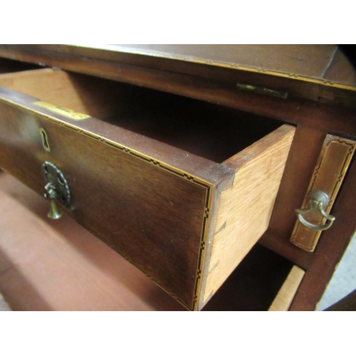 281 - An Edwardian lady's string inlaid mahogany  bureau with a fall flap, over two short/two long drawers... 