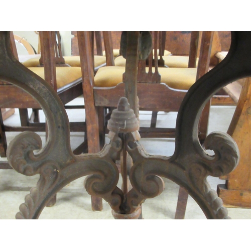 285 - A Continental inspired, cast iron patio table, decorated with fruiting vine and pierced crossover to... 