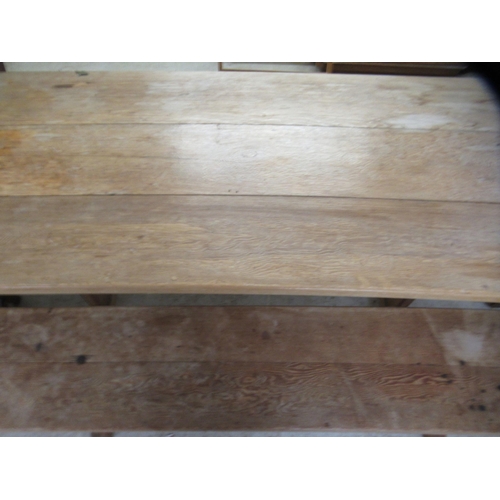 286 - An early 20thC rustically constructed, bleached oak, planked refectory table, raised on block suppor... 