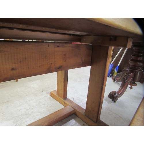 286 - An early 20thC rustically constructed, bleached oak, planked refectory table, raised on block suppor... 