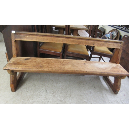 287 - A late 19thC pine pew bar back bench  62