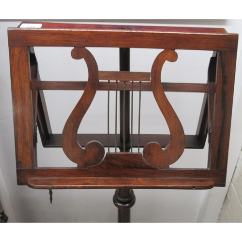 289 - A William IV rosewood lyre design sheet music stand, raised on a triform platform  47