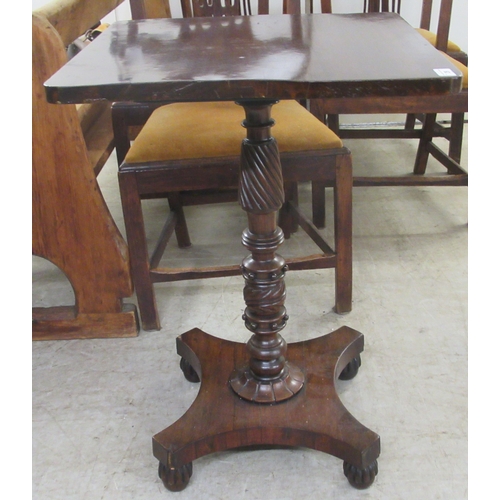 29 - A William IV mahogany tip-top table, raised on a spiral turned column and quatrefoil base and turned... 