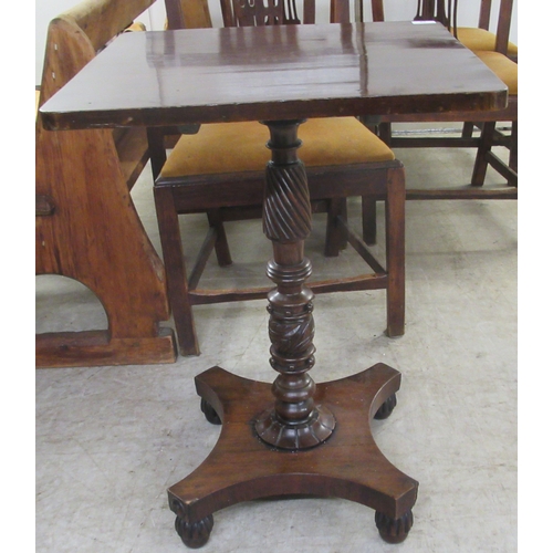 29 - A William IV mahogany tip-top table, raised on a spiral turned column and quatrefoil base and turned... 