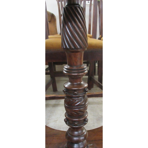 29 - A William IV mahogany tip-top table, raised on a spiral turned column and quatrefoil base and turned... 