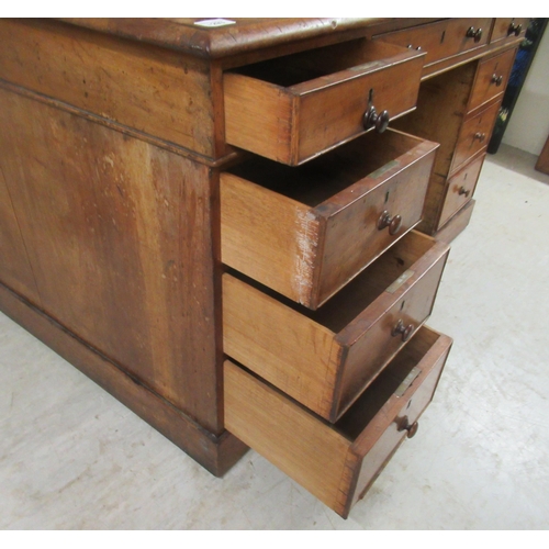 293 - A late Victorian mahogany, twin pedestal, nine drawer desk, on a plinth  30