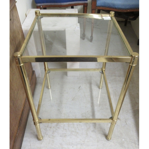 298 - A modern brass and glazed two tier occasional table  22