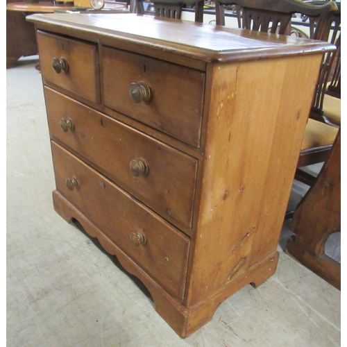 304 - A late 19thC stained pine, four drawer dressing chest, raised on bracket feet  32