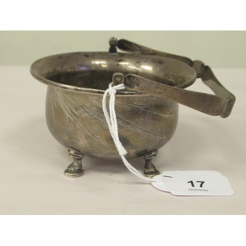 321 - A 1920s Chinese Zee Sung silver engraved sugar basin of cauldron form with a flared rim and swing ha... 