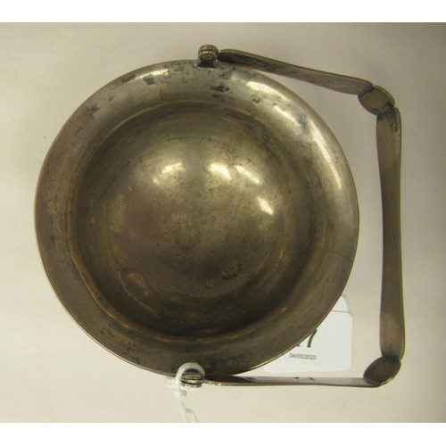 321 - A 1920s Chinese Zee Sung silver engraved sugar basin of cauldron form with a flared rim and swing ha... 