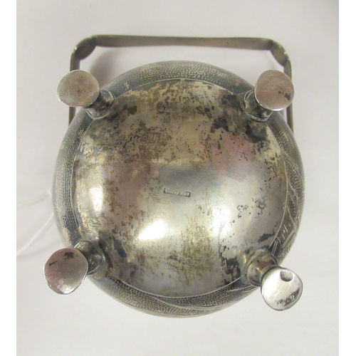 321 - A 1920s Chinese Zee Sung silver engraved sugar basin of cauldron form with a flared rim and swing ha... 