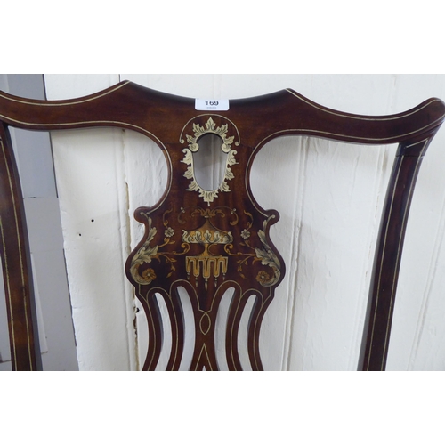 327 - An Edwardian mahogany framed string inlaid and marquetry hall chair, the high back with a yoke crest... 