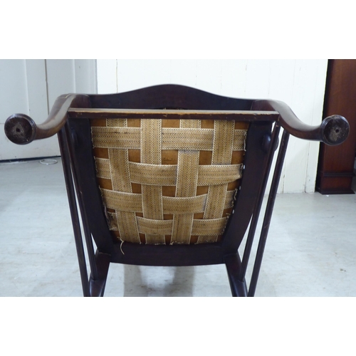 327 - An Edwardian mahogany framed string inlaid and marquetry hall chair, the high back with a yoke crest... 