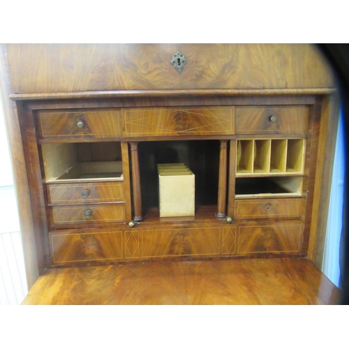 331 - A 19thC Biedermeier inspired mahogany secretaire a'abattant, the platform top over a frieze drawer, ... 