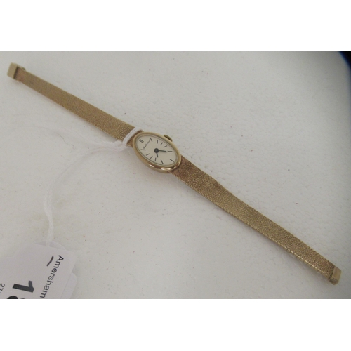 339 - A lady's Bueche Girod 9ct gold, oval cased bracelet wristwatch, faced by a baton dial