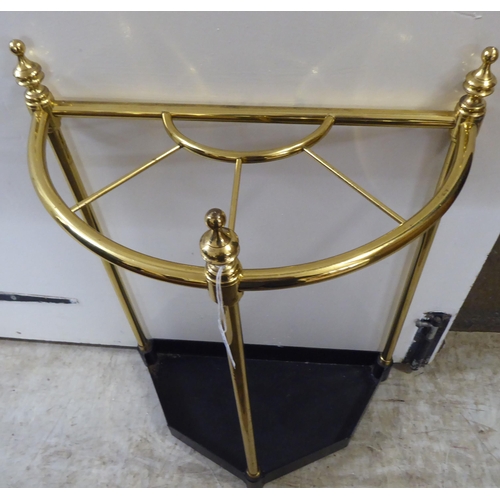 35 - A late Victorian style brass and cast iron demi-lune stickstand  22