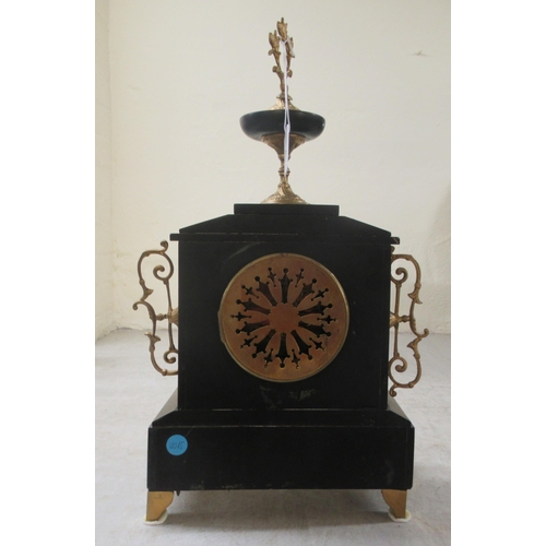 50 - An early 20thC marble and black slate cased mantel clock, on lion paw feet; faced by an Arabic dial ... 