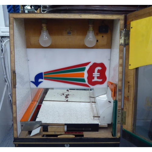 57 - A mid 20thC electric, easy push coin arcade game  27