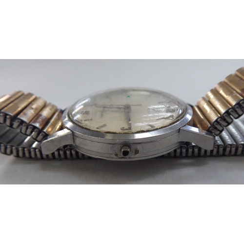 59 - An Omega Seamaster stainless steel cased wristwatch (damaged), faced by an Arabic and baton dial