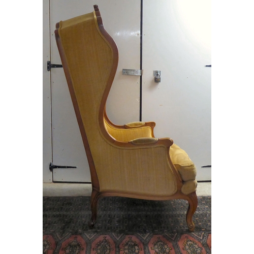 6 - A modern stained beech showwood framed, hall style porters chair, button upholstered in gold coloure... 