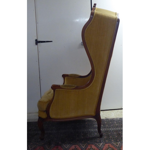 6 - A modern stained beech showwood framed, hall style porters chair, button upholstered in gold coloure... 