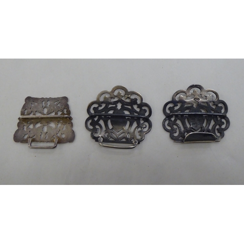 65 - Silver and white metal collectables: to include three napkin rings; and a two part silver nurse's be... 