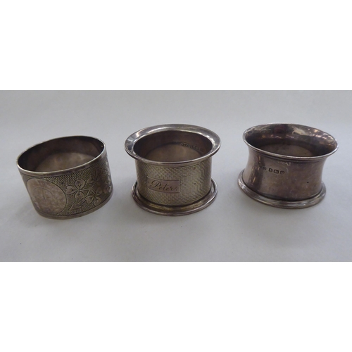 65 - Silver and white metal collectables: to include three napkin rings; and a two part silver nurse's be... 